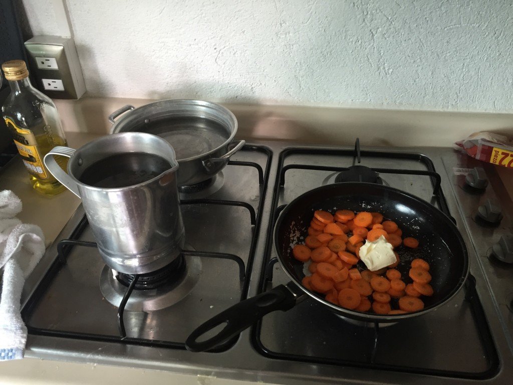 The two pots we use to warm water at a meal. Plus the sauteing carrots from breakfast this morning